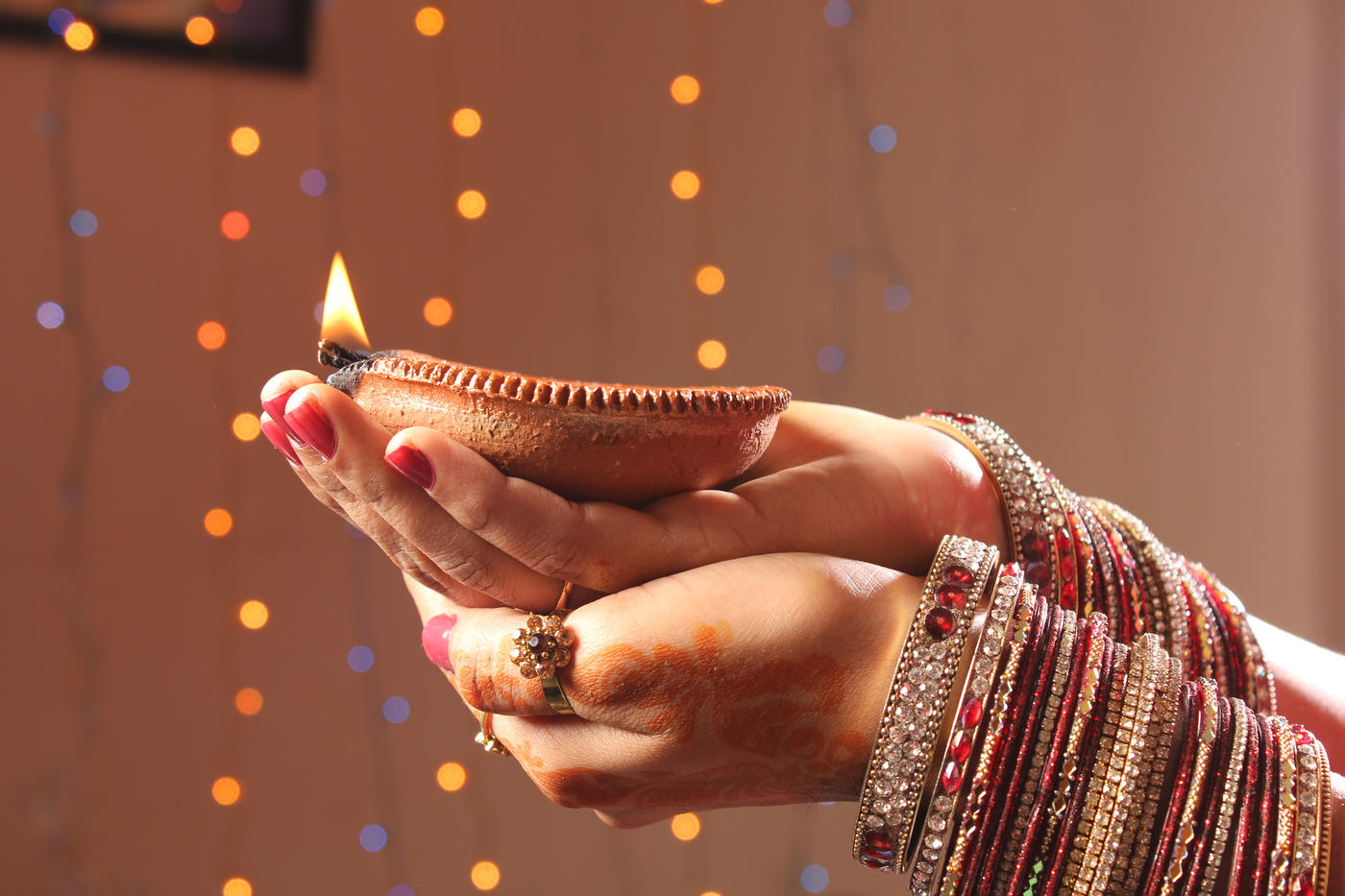 diwali-hands-holding-candle