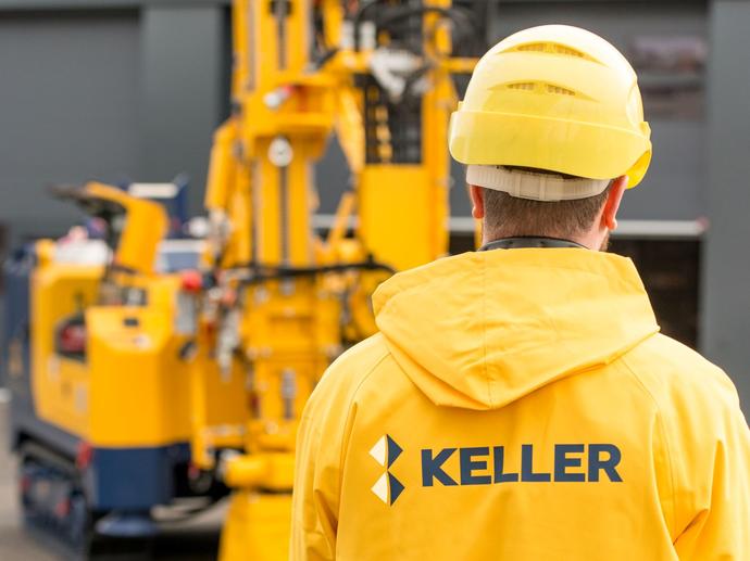 man in yellow jacket with keller logo on the back
